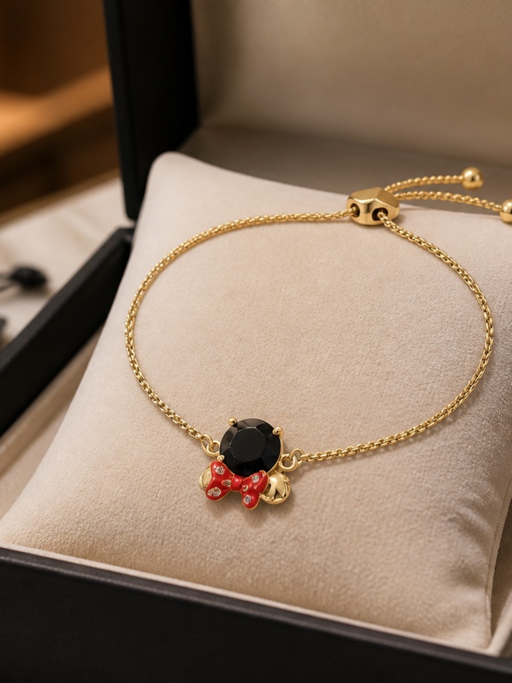 kate spade Gold Bracelet with Black Stone and Red Bow Charm